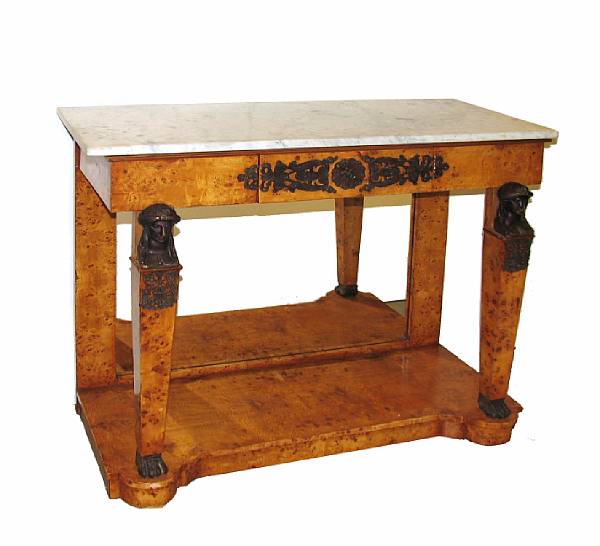 Appraisal: A pair of Empire style consoles with white marble tops