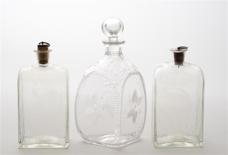 Appraisal: PAIR OF GERMAN ETCHED GLASS DECANTERS With later stoppers etched