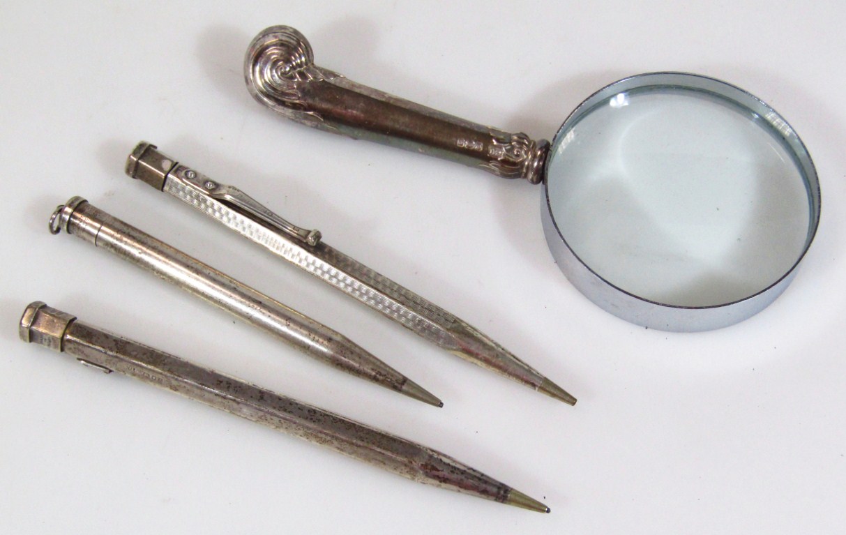 Appraisal: Three various silver cased propelling pencils of shaped outline with