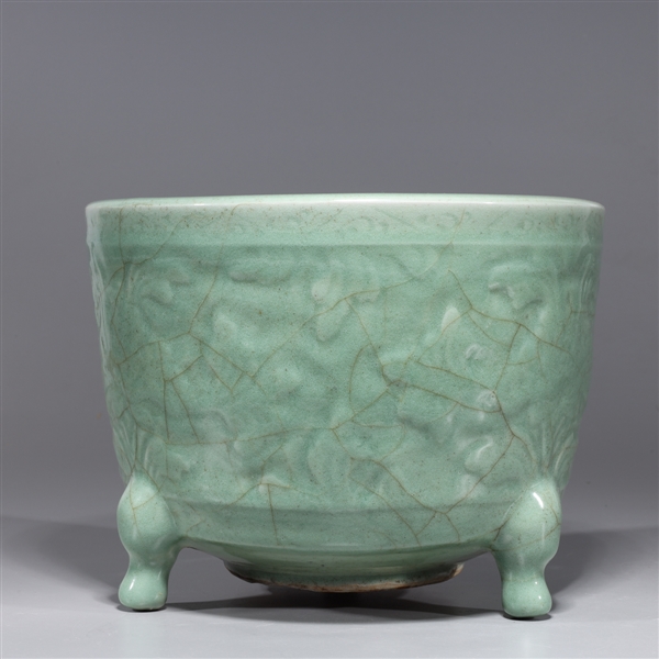 Appraisal: Chinese celadon glazed porcelain tripod censer with floral motif to