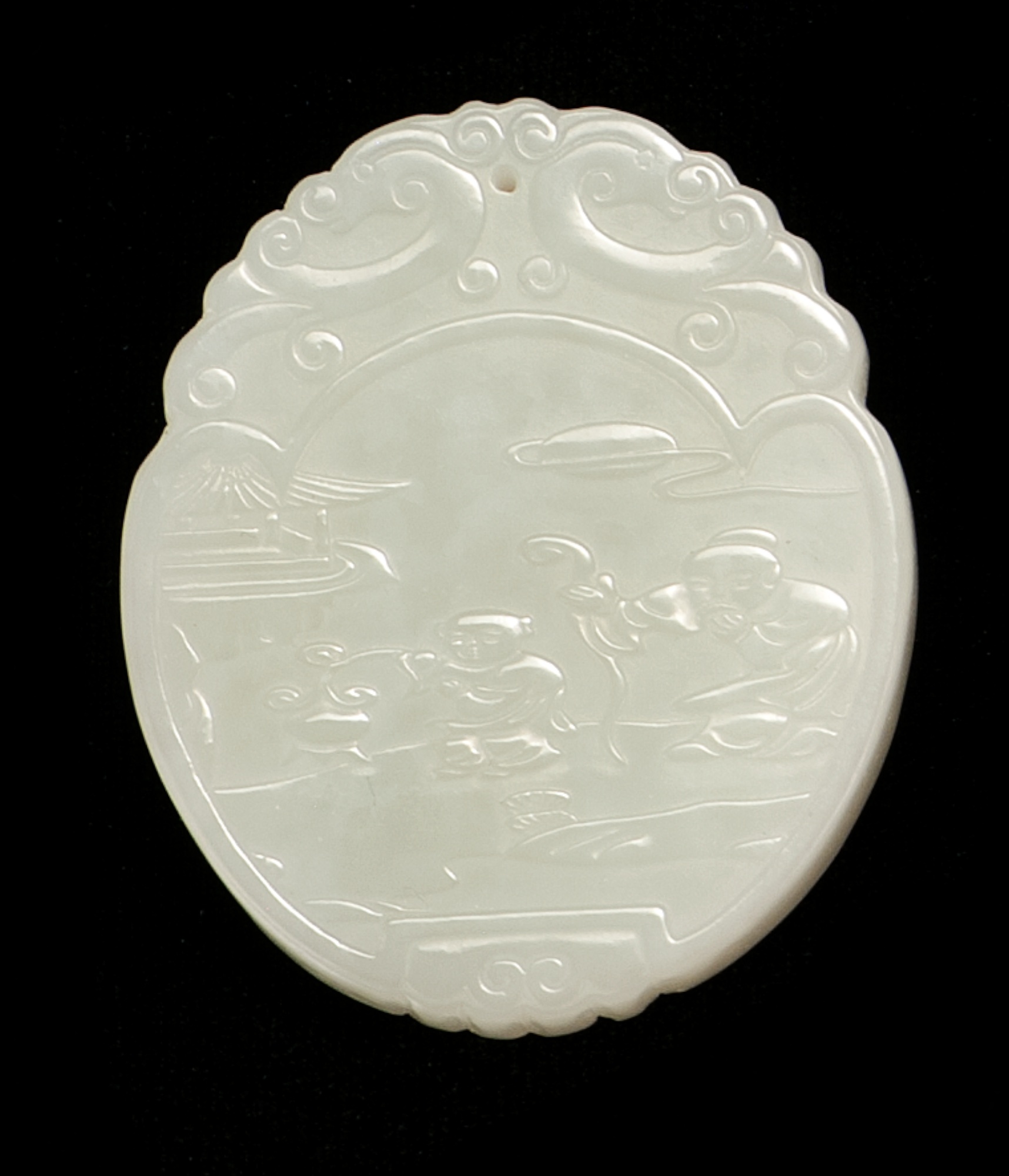 Appraisal: WHITE JADE PENDANT In oval form Carved with a sage