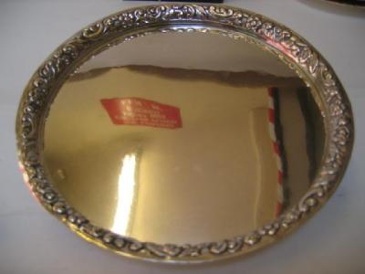 Appraisal: A CONTINENTAL SMALL CIRCULAR SALVER with raised scroll chased border