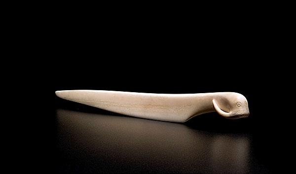 Appraisal: WALRUS IVORY FIGURAL LETTER OPENER th century the handle carved