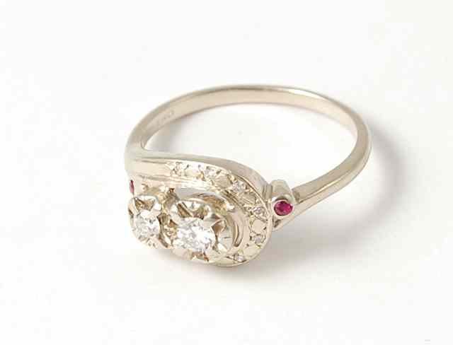 Appraisal: DIAMOND RUBY AND FOURTEEN KARAT GOLD RING featuring two diamonds