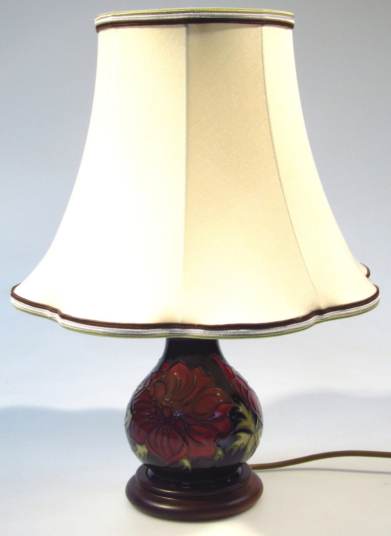 Appraisal: A Moorcroft Anemone pattern lamp of inverted circular form with