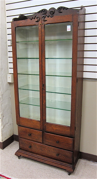 Appraisal: AN OAK MEDICAL SUPPLY CABINET American c having five glass