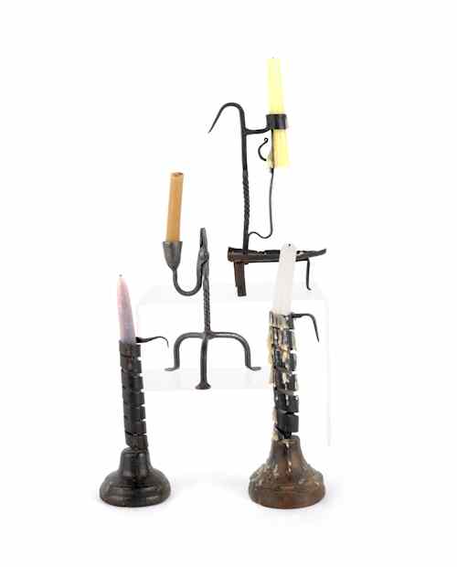 Appraisal: Four iron candleholders th c tallest -