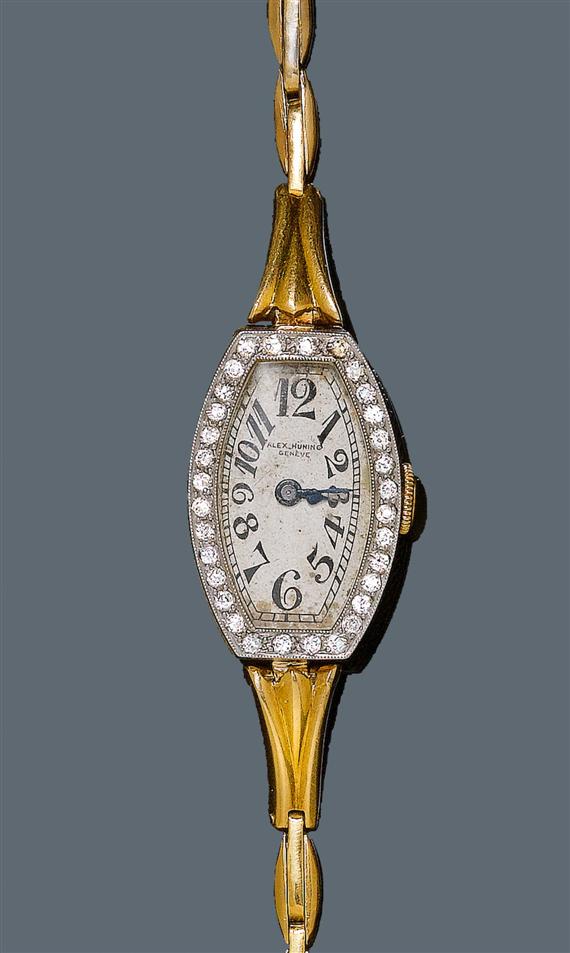 Appraisal: DIAMOND LADY'S WRISTWATCH ca Yellow gold Tonneau-shaped case No with