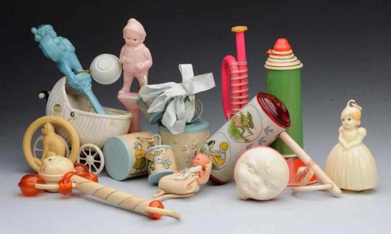 Appraisal: Lot of Celluloid Toys Rattles Baby in carriage telescoping tower