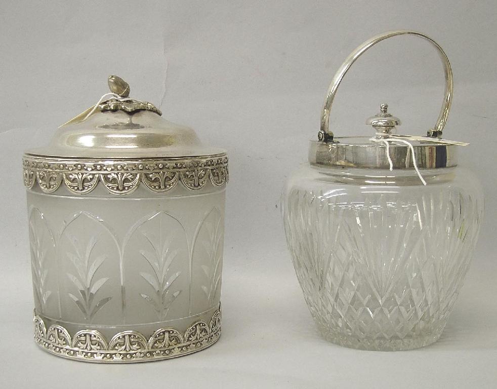 Appraisal: Lidded and mounted swing handled cut glass biscuit barrel by