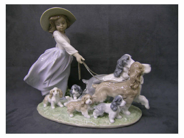 Appraisal: Lladro Porcelain Puppy Parade Figural Grouping depicting girl walking puppies