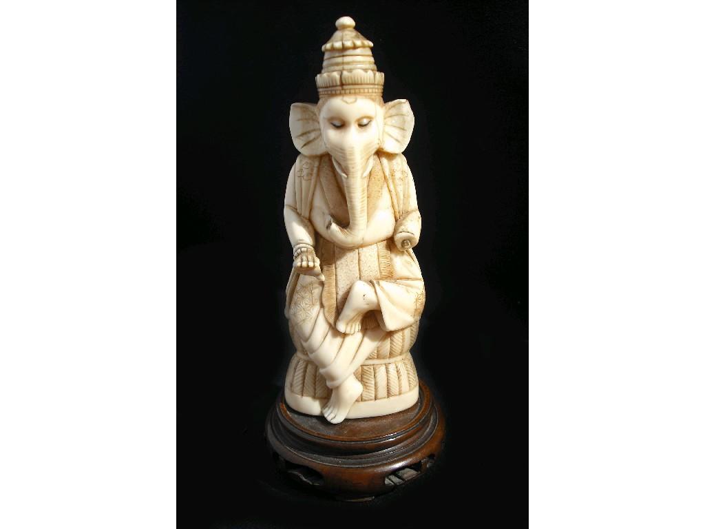 Appraisal: th century ivory carved figure of Ganesh upon a hardwood