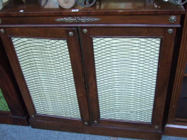 Appraisal: A late th century walnut pier cabinet with brass mounted