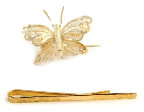 Appraisal: A ct gold tie clip g and a filigree white