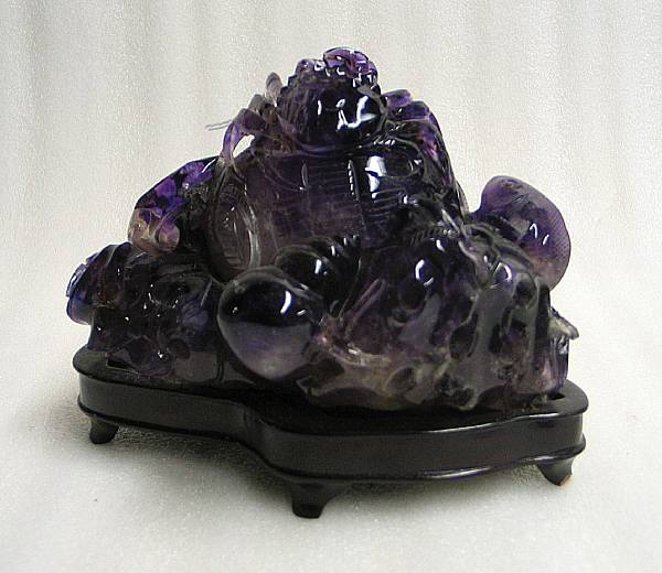 Appraisal: An amethyst carving Fashioned as a a fisherman's basket surrounded