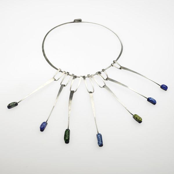 Appraisal: STYLE OF CLAIRE FALKENSTEIN Hammered silver necklace with fused colored