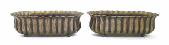 Appraisal: A Pair of Brass Jardinieres each having an elongated ribbed