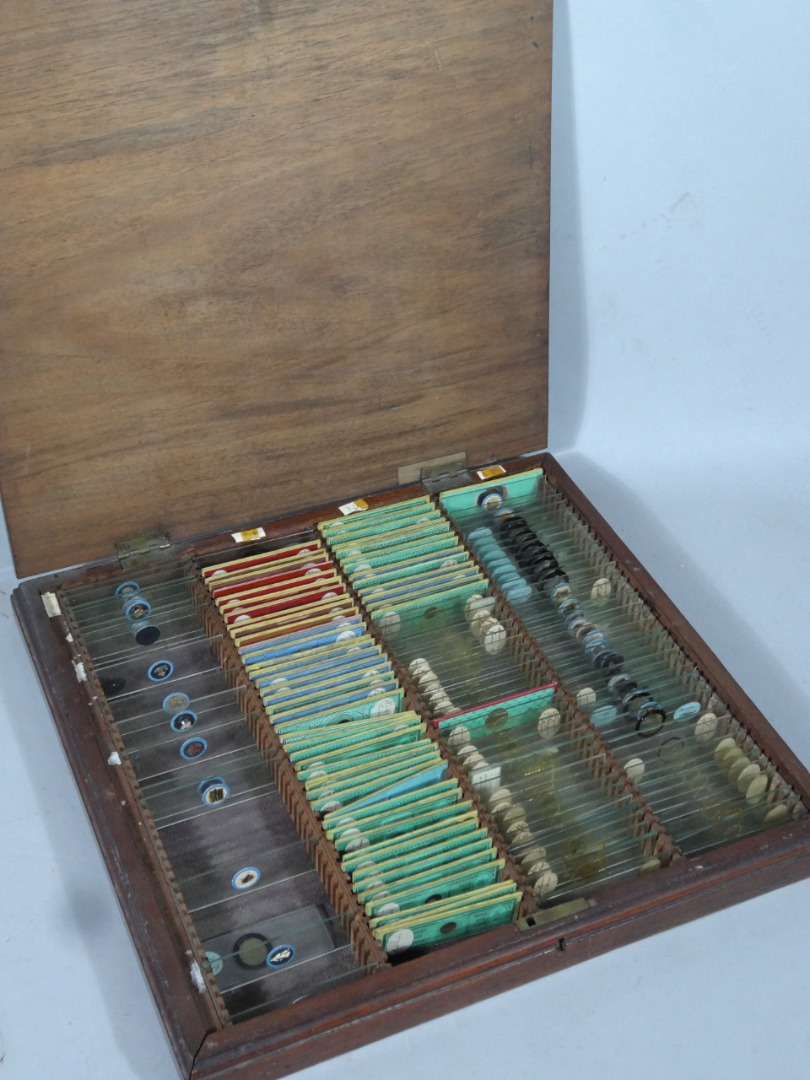 Appraisal: A thC mahogany slide case hinging to reveal a quantity