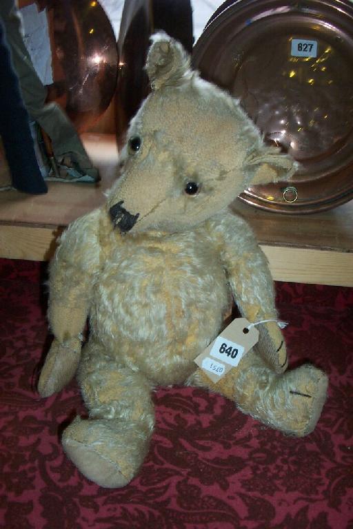 Appraisal: A plush teddy bear with glass eyes -