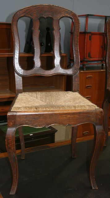 Appraisal: A pair of George I style oak hall chairs with