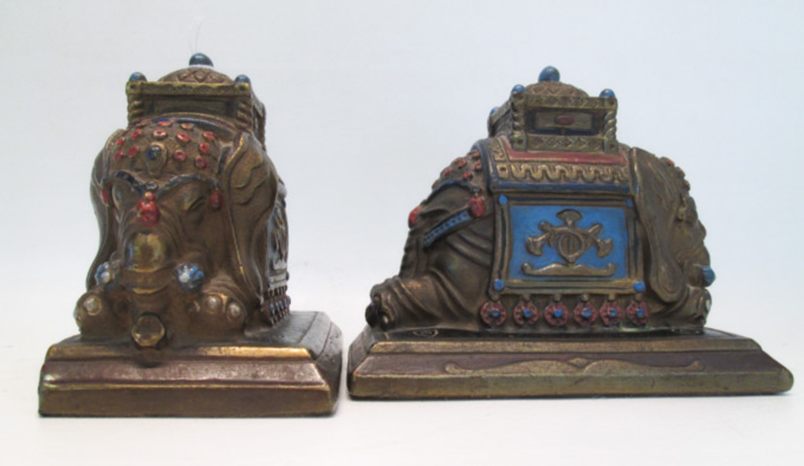 Appraisal: PAIR OF BRONZE CLAD BOOKENDS depicting Indian elephants kneeling with