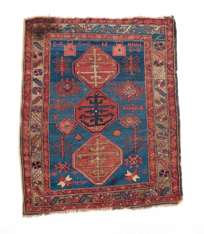 Appraisal: CAUCASIAN RUG First quarter th century Red medallions on abrash