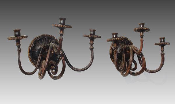 Appraisal: th C CARVED WOOD SCONCES Three light scroll and ball