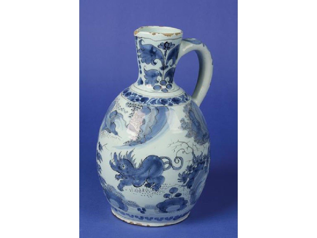 Appraisal: A DELFTWARE BLUE AND WHITE JUG decorated in the Chinese