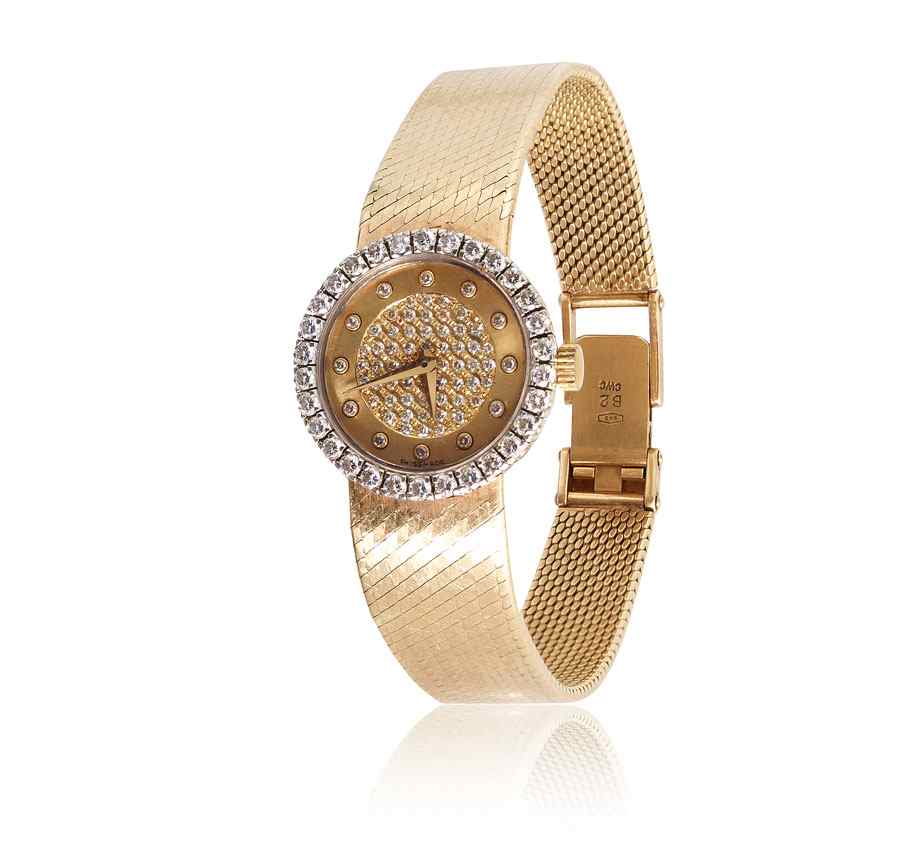 Appraisal: K GOLD AND DIAMOND DRESS WATCH K yellow gold case