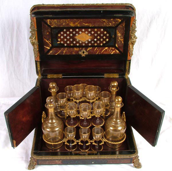 Appraisal: French tantalus liqueur set marked Brevete with Baccarat gilt glasses