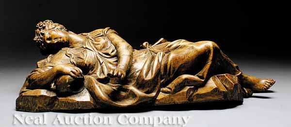 Appraisal: A Continental Carved Wood Figure of a Reclining Woman possibly