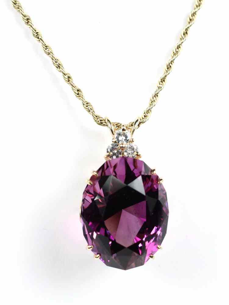 Appraisal: PENDANT - Amethyst and diamond pendant set with an oval