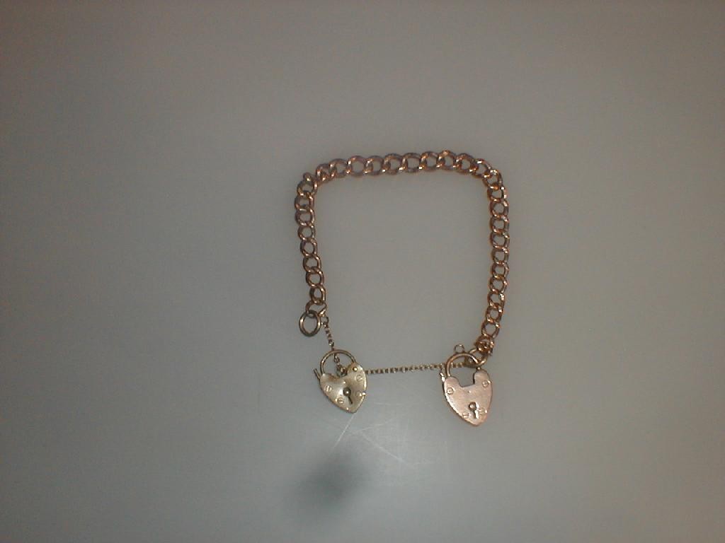 Appraisal: A ct rose gold curb link bracelet with extra padlock