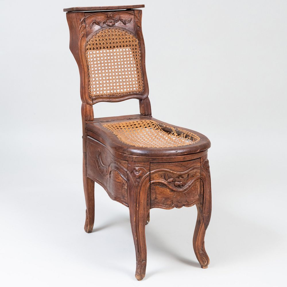 Appraisal: Louis XV Provincial Walnut and Caned Bidet Fitted with a