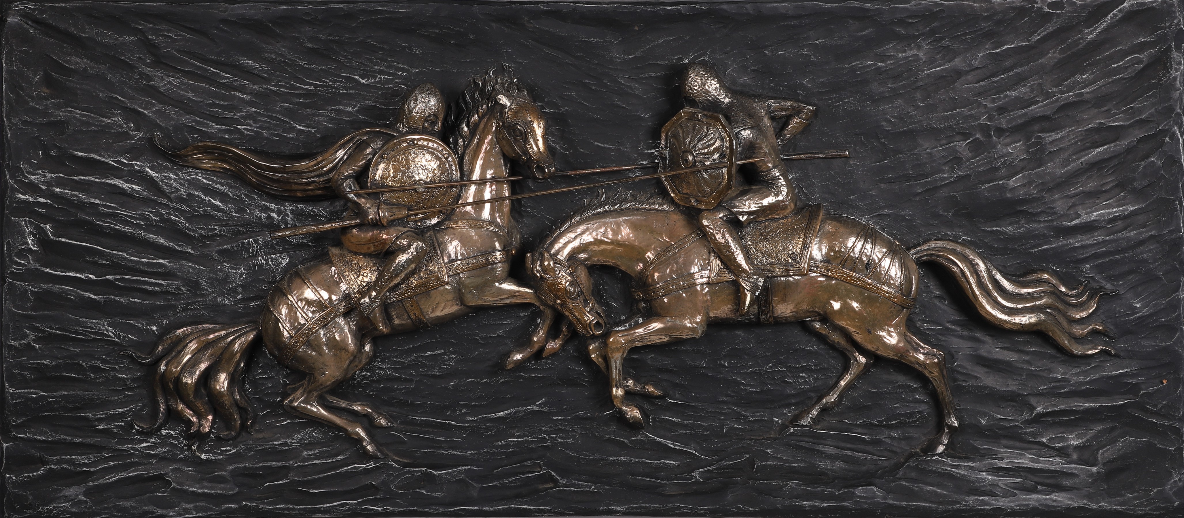 Appraisal: Modern Design -D wall mounted plaque of jousting composition ebonized