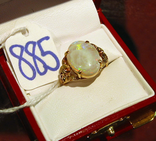 Appraisal: OPAL AND FOURTEEN KARAT GOLD RING centering an oval shaped