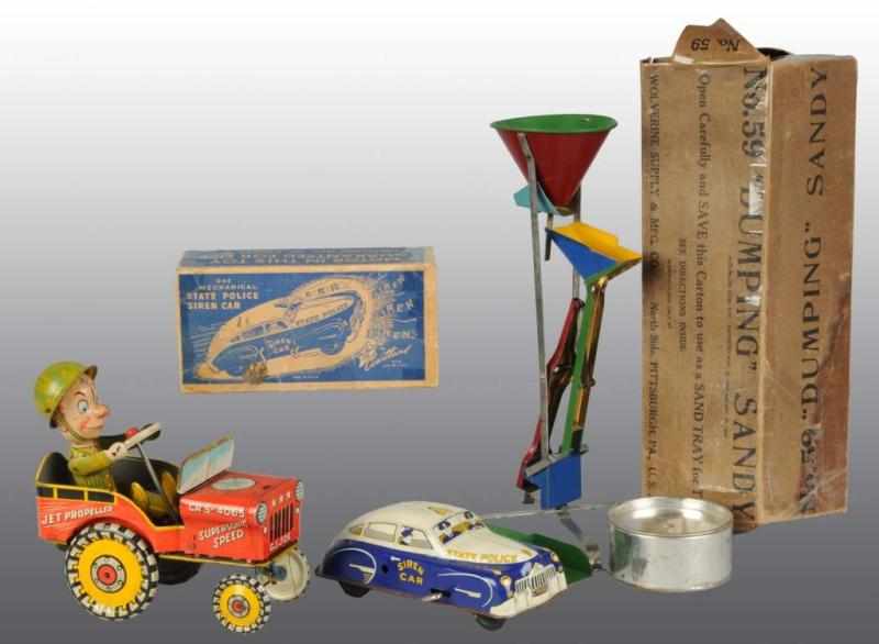 Appraisal: Lot of Tin Toys Description All are working Includes one