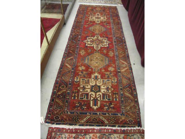 Appraisal: Heriz Persian Handmade Runner six geometric medallions earthtones blue trim