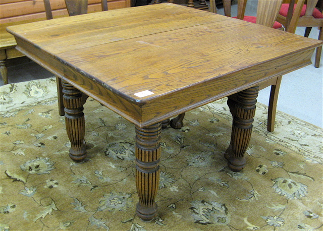 Appraisal: SQUARE OAK DINING TABLE American c standing on four round