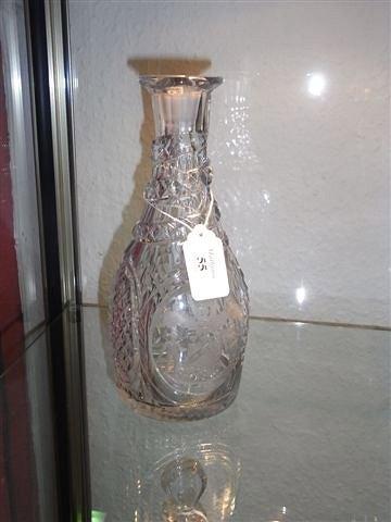 Appraisal: AN ARMORIAL GLASS DECANTER with wrythen banded neck hobnail decoration