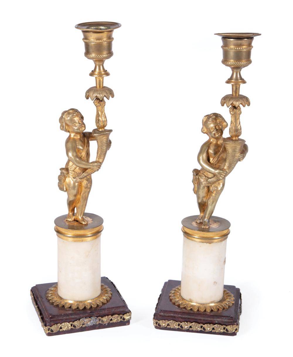 Appraisal: Pair of Regency Bronze and Marble Figural Candlesticks cherub holding