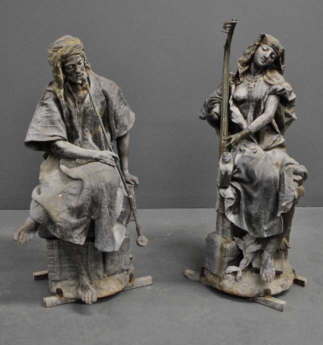 Appraisal: - Two large cast zinc Egyptian seated figures probably removed