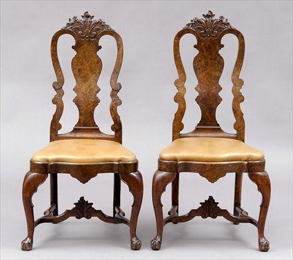 Appraisal: PAIR OF DUTCH ROCOCO CARVED WALNUT SIDE CHAIRS Each foliate