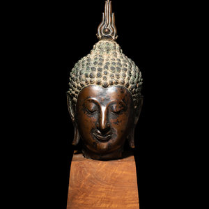 Appraisal: A Thai Bronze Head of Buddha cast with a downcast