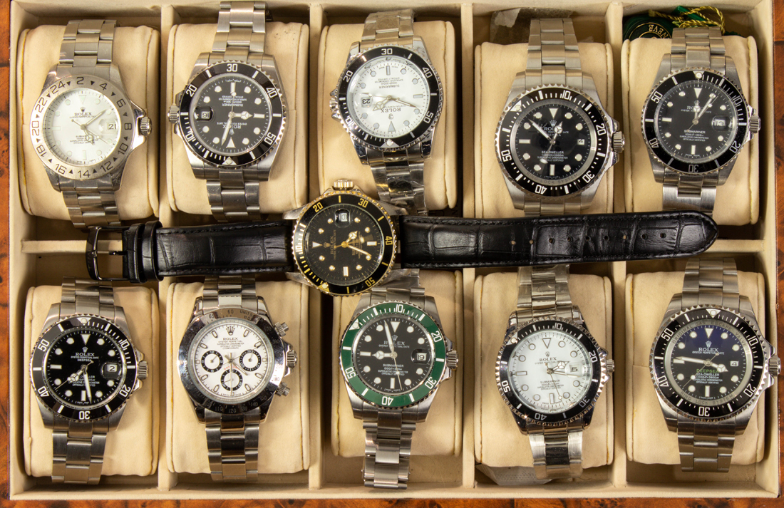 Appraisal: Collection of reproduction Rolex watches all in a burlwood presentation