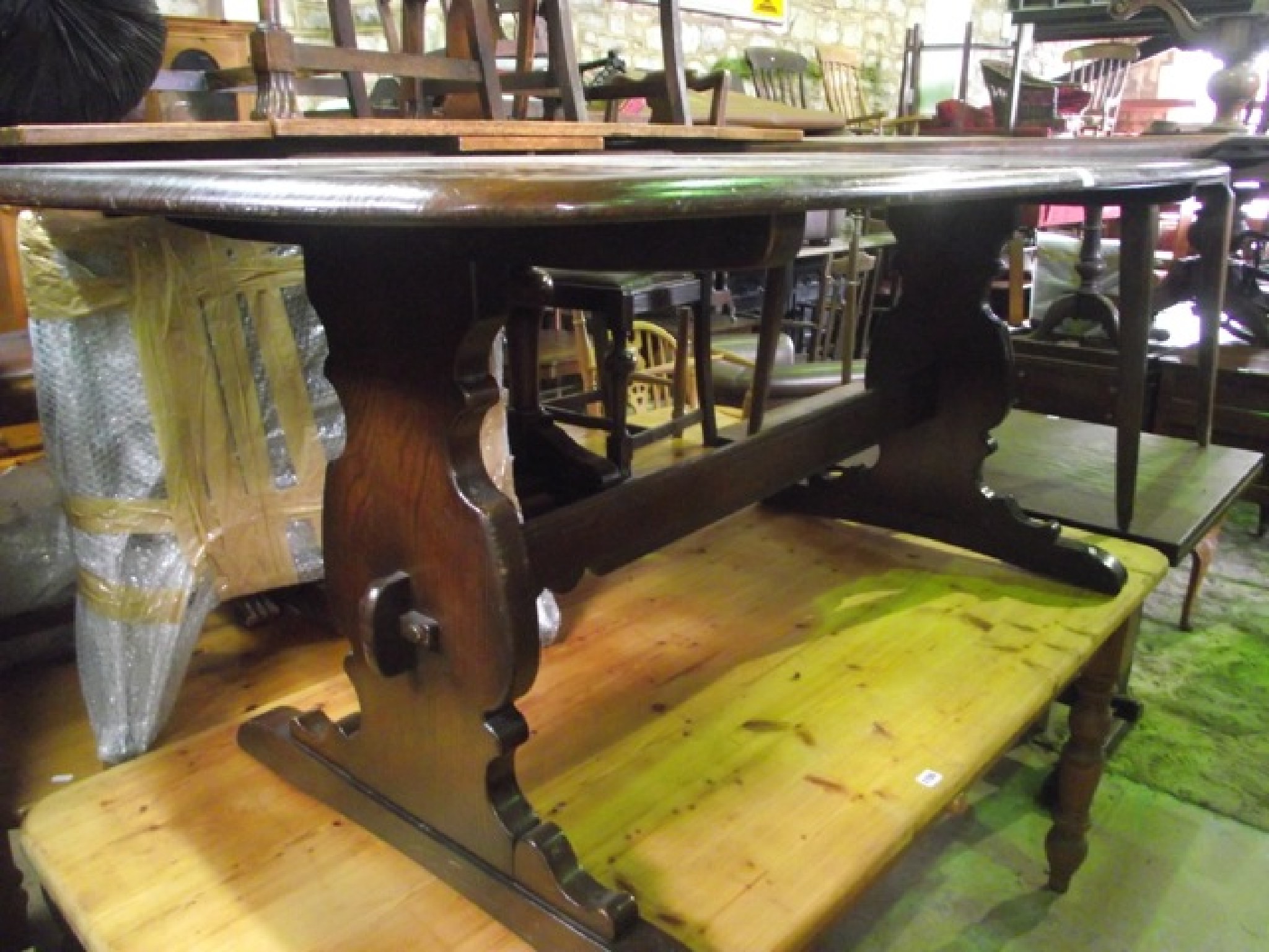 Appraisal: An Ercol dark elm refectory dining table of rectangular form