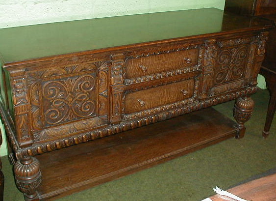 Appraisal: A heavy oak carved sideboard or buffet in the Jacobean