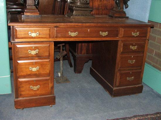 Appraisal: A LATE VICTORIAN MAHOGANY PEDESTAL DESK fitted one long central