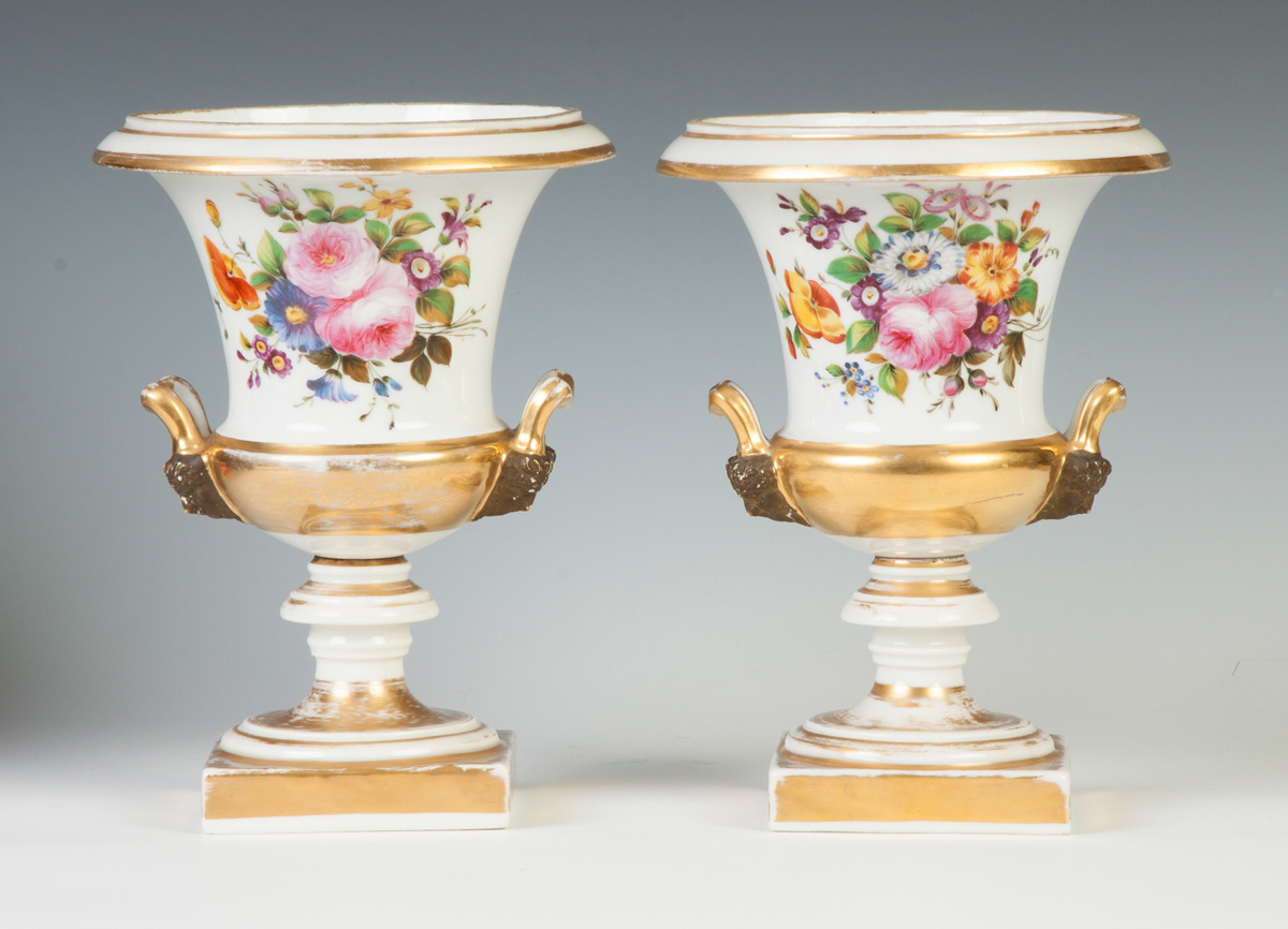 Appraisal: Pair of Hand Painted Gilded Paris Urns Masked handles