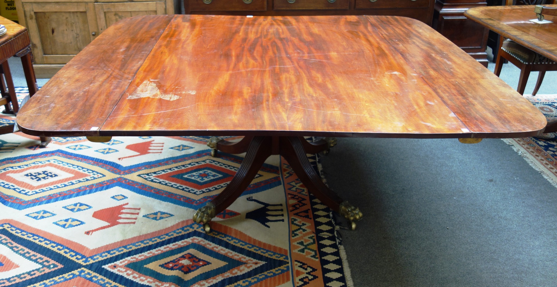 Appraisal: A Regency mahogany rectangular dining table with pair of additional